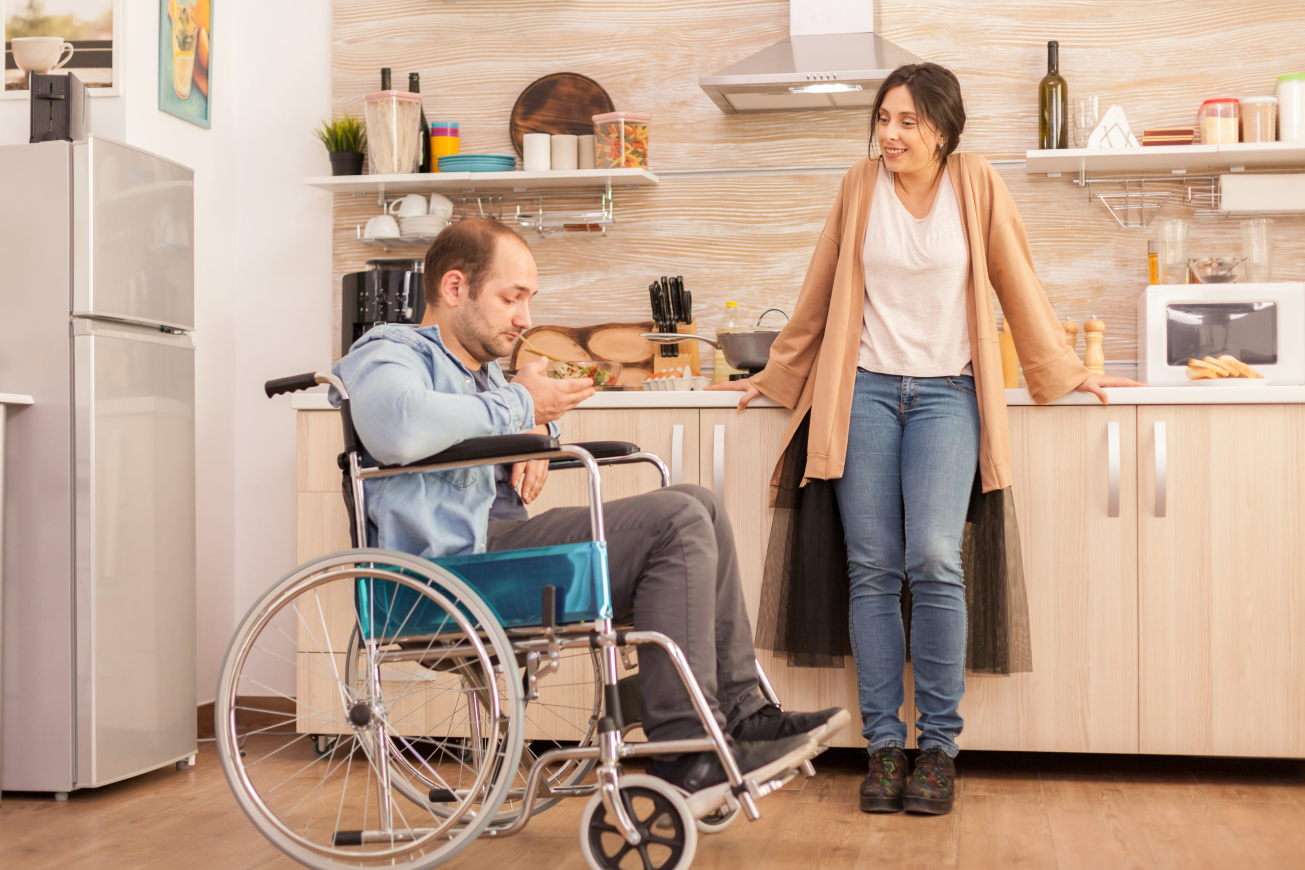 Disabled man looking at salad